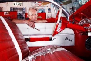 Red and white leather upholstery in a classic vintager vehicle. 