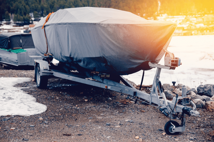 If you don’t have the room to keep your boat indoors during the winter, covering it is your best option to keep it dry.