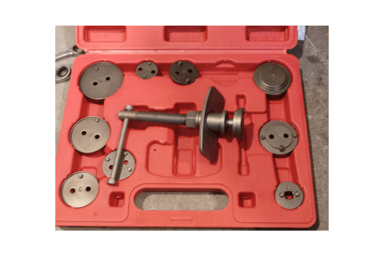 This is a compression piston tool. The kit comes with a bunch of adapters for various makes and models. This also works on the threaded style of caliper, provided the center hub is pinned.